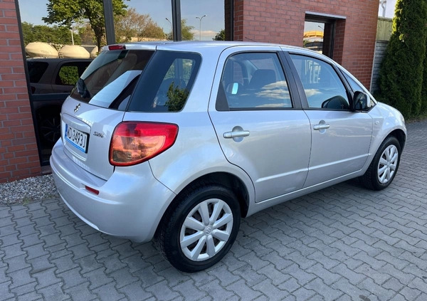 Suzuki SX4 cena 26900 przebieg: 153000, rok produkcji 2012 z Borne Sulinowo małe 254